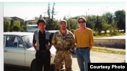 Bruce Pannier (right) poses with local soldiers in Batken in 1999.