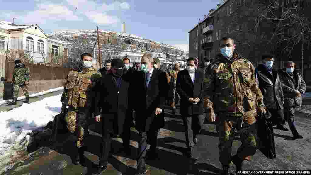 Pashinian (center) walks through Sisian in the Syunik region. The December 21 visit turned into a public-relations disaster for the embattled prime minister as crowds blocked his motorcade and he was forced to travel by helicopter to the southern Armenian town.