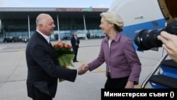 Bulgarian Prime Minister Rosen Zhelyazkov (left) greets European Commission President Ursula von der Leyen at Plovdiv Airport after her plane was hit by radar jamming in a suspected Russian operation on August 31. The plane landed safely despite the attack.