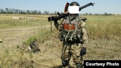 Беларускі салдат з украінскага добраахвотніцкага палку «Азоў», баец атраду «Пагоня» з пазыўным «Кім». 