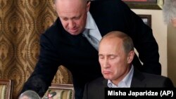 Президент Владимир Путин и предприниматель Евгений Пригожин