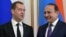 Armenia -- Russian Prime Minister Dmitry Medvedev (L) and his Armenian counterpart Ovik Abrahamyan arrive to hold a joint press conference following their talks in Yerevan on April 7, 2016.