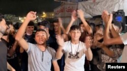 Палестинцы в Хан-Юнисе на юге сектора Газа празднуют достижение соглашения о перемирии. 9 октября 2025 года