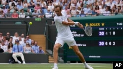Russia's Daniil Medvedev competes in the men's singles second round match at Wimbledon in July 2021. This year the British government has ruled that no players from Russia or Belarus may take part.