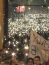 Protesters In Belgrade Light Up Night Sky During Moment Of Silence 