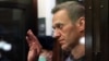 Jailed Russian opposition activist Aleksei Navalny gestures during a court hearing in Moscow in February 2021. 
