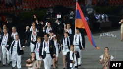 U.K. -- Armenia's flagbearer Arman Yeremyan (2ndR) leads his delegation during the opening ceremony of the London 2012 Olympic Games, 27Jul2012