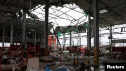 A postal distribution center was hit by Russian missiles in the village of Korotych, outside of Kharkiv, on October 22. Six postal workers were killed.