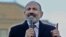 Armenian Prime Minister Nikol Pashinian addresses his supporters during a gathering on Republic Square in Yerevan on February 25.