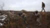 Ukrainian soldiers conduct exercises at a training ground near the front line in the Donetsk region on February 23.