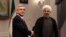 Iran -- Armenian President Serzh Sarkisian (L) meets with Iran's new President Hasan Rohani (R) at his office in Tehran on August 5, 2013.