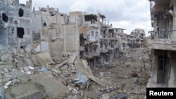 Хомс шаарынын Журет аш-Шая районундагы кыйраган турак-үйлөр. 29-январь 2013