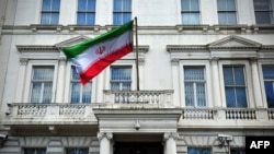 The Iranian flag hangs outside the Iranian Embassy in London. (file photo)