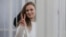 Katsyaryna Andreyeva signals to supporters in the courtroom during her trial in Minsk in February 2021.