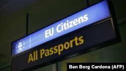 Malta - An immigration sign at Malta International Airport, 4Dec2007.