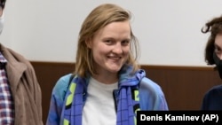 Natalya Tyshkevich and other Doxa editors wait for a court session in Moscow in April 2021.