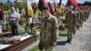 Ukrainian military cadets visit the graves of Ukrainian soldiers who were killed during Russia's invasion of Ukraine to mark the Orthodox feast of Palm Sunday at the Lychakiv cemetery in Lviv on April 28.