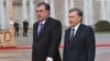 Uzbek President Shavkat Mirziyoev (right) is welcomed by Tajik President Emomali Rahmon in Dushanbe on March 9.