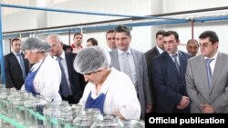 Nagorno-Karabakh - Armenian Prime Minister Tigran Sarkisian (C) visits a food-processing plant in the Askeran district, 1Aug2011.