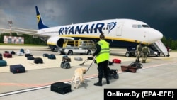 Belarus scrambled a military jet to escort an Athens-to-Vilnius Ryanair flight to land in Minsk just before it was to leave Belarusian airspace.
