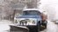 Armenia -- Municipal vehicle cleans the street in Yerevan after a heavy snowfall, Yerevan, 01Feb2011