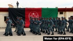 Afghan policemen march during a graduation ceremony earlier this month.