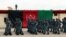 Afghan police officers march during a graduation ceremony.