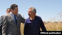 Armenia - Prime Minister Tigran Sarkisian talks to a farmer in Gegharkunik province, 30Aug2011.