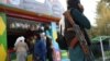 A Taliban soldier carrying a rifle stands in an amusement park in Kabul. (file photo)