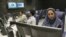 Iran -- Iranian TV anchor Suzanne Modaressi (R) works at the newsroom of Iranian news channel "Press TV" in Tehran, 20Jun2007