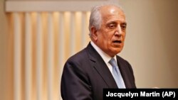 U.S. envoy Zalmay Khalilzad speaks in Washington on February 8.