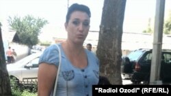 Tatyana Khuzhina says she had the coin for years as a memento of her mother and was carrying it in her wallet when she entered the former Soviet republic from Russia.