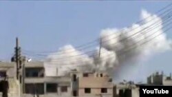نمایی از بمباران شهر حمص در سوریه از سوی نیروهای بشار اسد.
