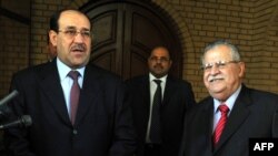 Yragyň prezidenti Jalal Talabani (sagda) we premýer-ministri Nuri al-Maliki