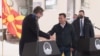 Serbian President Aleksandar Vucic (left) shakes hands with North Macedonia's prime minister, Zoran Zaev, at the Tabanovce border crossing for the ceremonial handover of some COVID-19 vaccines on February 14. 
