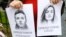 A woman holds a portrait of Belarusian journalist Raman Pratasevich and his girlfriend, Sofia Sapega, during a protest in the Latvian capital, Riga, that was held in solidarity with the pair, who were arrested in Minsk airport last year. (file photo)