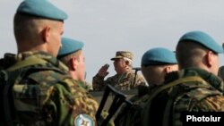 Armenia - General Yuri Khachaturov, chief of the Armenian army's General Staff, salutes troops from CSTO member states holding exercises at Marshal Bagramian shooting range, 30Sep2015.