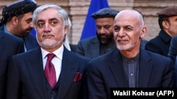 Afghan President Ashraf Ghani (right) and his political rival, Abdullah Abdullah, seem to have resolved a longstanding dispute. 