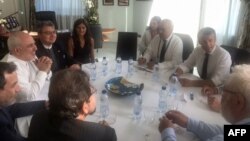 محمدجواد ظریف (سمت چپ، نفر سوم) در دیدار با رئیس‌جمهوری و وزیر خارجه فرانسه. 