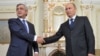 Russia -- Russia's president Vladimir Putin (R) and Armenia's president Serzh Sarkisian shake hands during a meeting at Novo-Ogaryovo residence, Moscow, September 3, 2013.