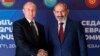 Russian President Vladimir Putin (left) and Armenian Prime Minister Nikol Pashinian pose before of a meeting of the Supreme Eurasian Economic Council in Yerevan on October 1.