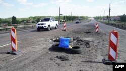 Ուկրաինա - Հրետակոծությունների հետևանքները Խերսոնի շրջանի Անտոնովսկի կամրջի վրա, հուլիս, 2022թ.