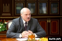 On August 9, the first anniversary of the disputed vote, Belarusian leader Alyaksandr Lukashenka dismissed "those nasty things that you throw into my face, saying that I'm a dictator." (file photo)