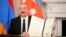 U.S. - Azerbaijan President Ilham Aliyev holds a signed trilateral agreement during a ceremony with Armenian Prime Minister Nikol Pashinian and President Donald Trump at the White House, August 8, 2025.