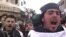 Участники акции протеста против режима президента Сирии Башар аль-Ассада в Кафранбеле, 19 февраля 2012 года.  