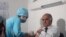 Deputy Tajik Health Minister Samariddin Aliev gets vaccinated against the coronavirus. Authorities in Tajikistan have now made coronavirus vaccinations compulsory for anyone over 18 years of age. 