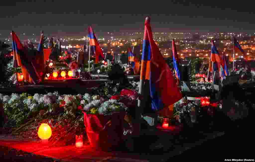 Armenian flags and candles cover Yerevan&#39;s Yerablur military cemetery on December 18. The photo was taken on the eve of three days of national mourning for those who died fighting Azerbaijani forces in and around Azerbaijan&#39;s breakaway region of Nagorno-Karabakh.