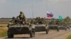 An armored convoy of Russian troops drives through the Russian-held Zaporizhzhya region on July 23.