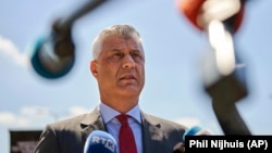 Kosovar President Hashim Thaci speaks to the media as he arrives at the Kosovo Specialist Chambers in The Hague on July 13. 