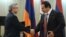Armenia - President Serzh Sarkisian (L) and Prosperous Armenia Party leader Gagik Tsarukian shake hands during an award ceremony at the National Olympic Committee, Yerevan,26Dec,2012.